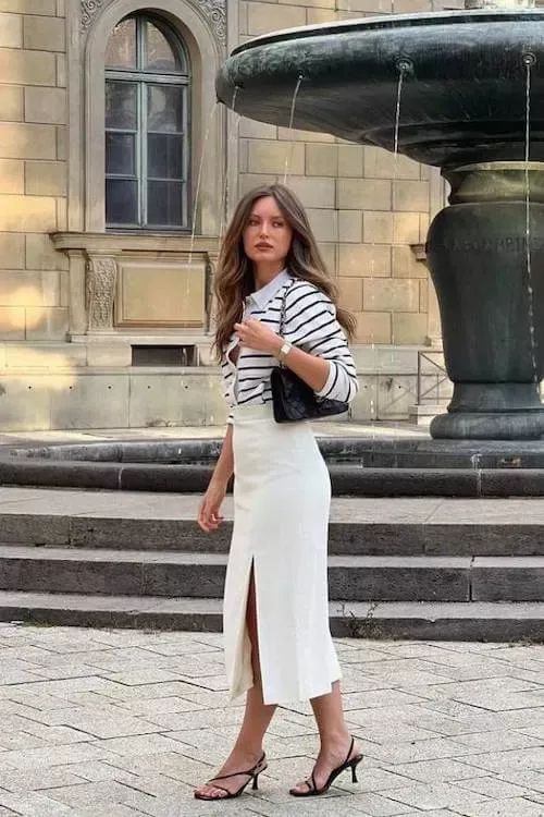 Striped long-sleeve top with a white midi skirt